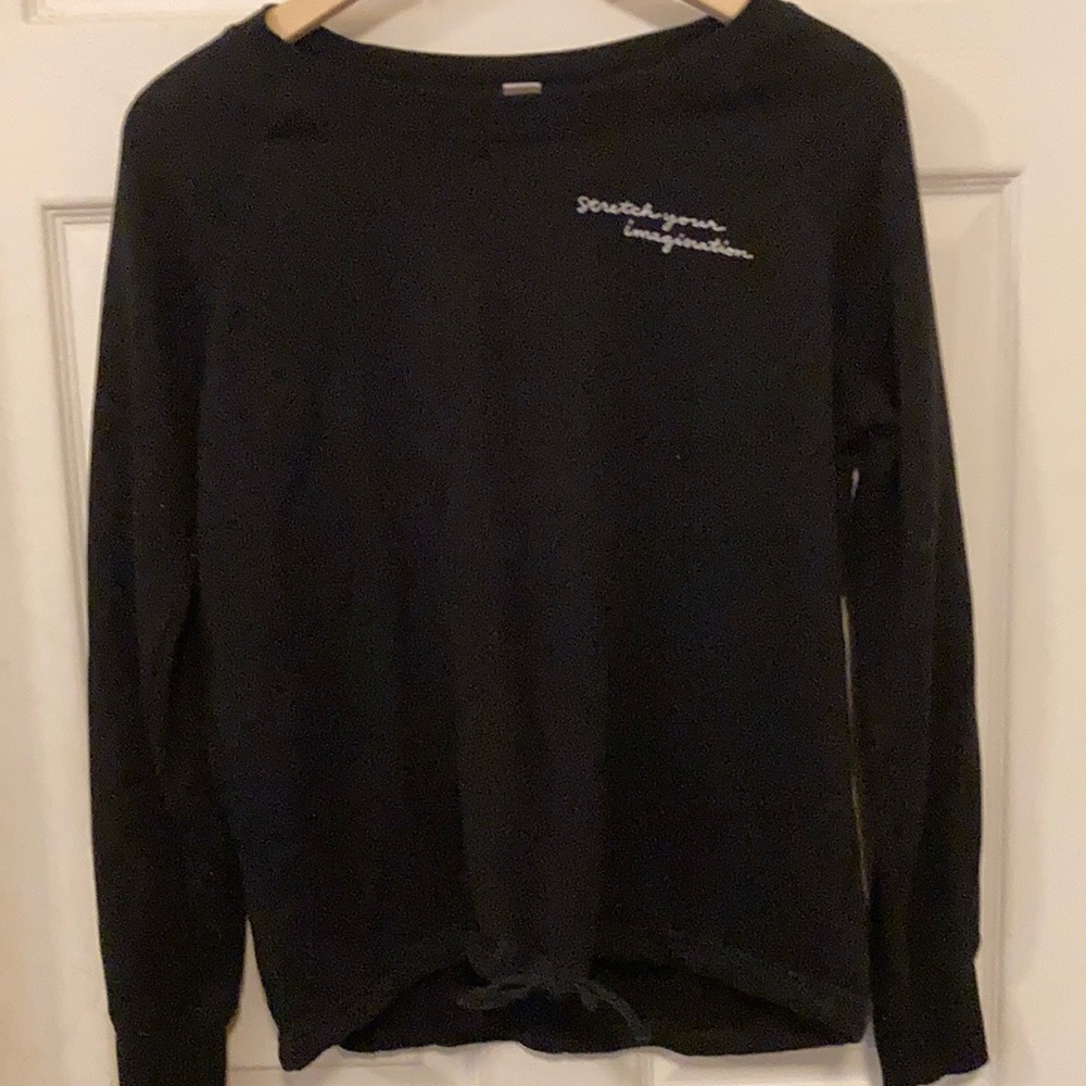 cute black crew neck with small white writing and bow detail!